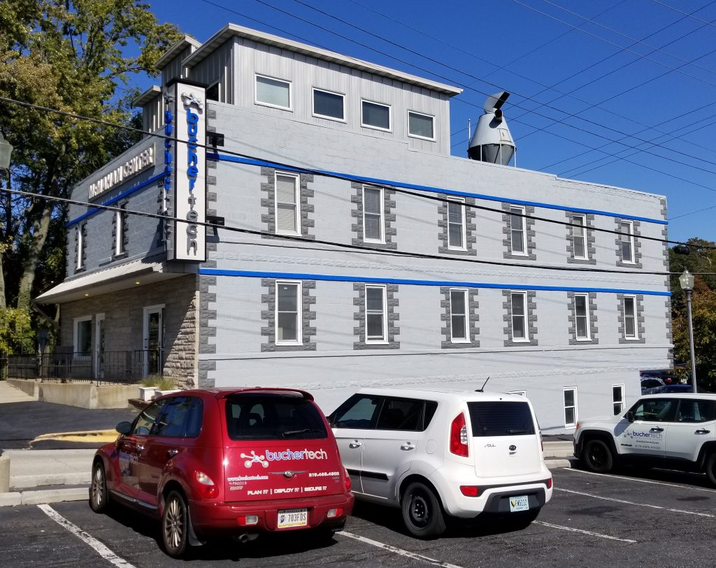 Buchertech office building on McMahon Avenue with cars parked out front